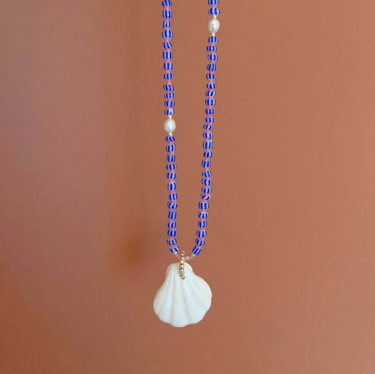 Beaded shell boho necklace with pearls.