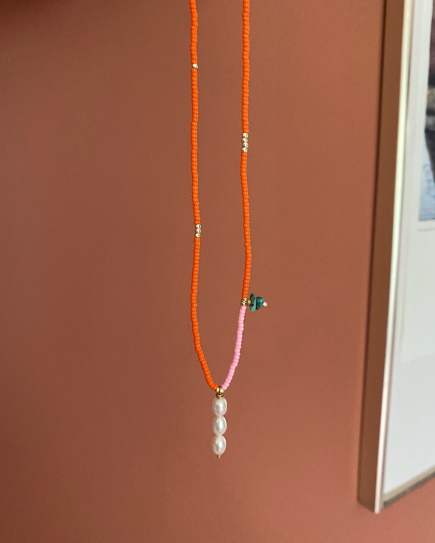 Sunset triple pearl necklace